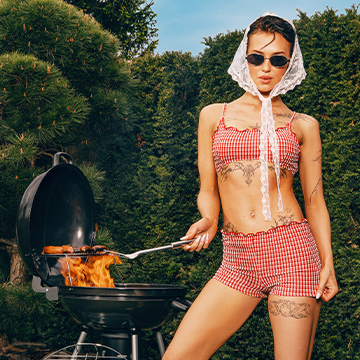 Promotes a summer fashion look styled for an outdoor barbecue, conveying casual, playful clothing suitable for warm-weather leisure and social gatherings.