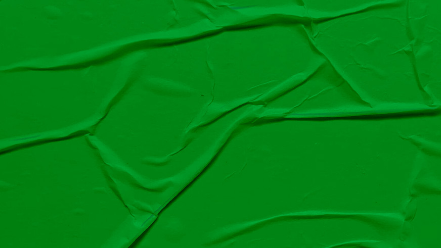 "A textured surface with visible creases and folds, resembling crumpled material or fabric. The image conveys a sense of texture and depth but contains no specific objects or identifiable content. It serves as a neutral or abstract visual background."